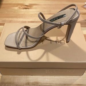 Nude, strapy heels made by Billini. Never worn.